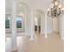 Open concept living area with high ceilings and neutral color palette at 9106 Panzani Pl, Windermere, FL 34786