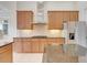 Modern kitchen with granite countertops and stainless steel appliances at 9106 Panzani Pl, Windermere, FL 34786