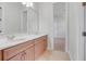 Double vanity bathroom with light wood cabinets at 9106 Panzani Pl, Windermere, FL 34786