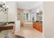 Luxurious bathroom with a soaking tub, double vanity, and a walk-in shower at 9106 Panzani Pl, Windermere, FL 34786