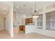 Open dining area with chandelier and view of kitchen at 9106 Panzani Pl, Windermere, FL 34786