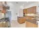 Kitchen with island, granite countertops, and stainless steel appliances at 9106 Panzani Pl, Windermere, FL 34786