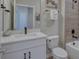 Clean bathroom with a single vanity, toilet, and bathtub at 2120 Broome St, Kissimmee, FL 34743