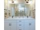 Double vanity bathroom with modern fixtures and a shower/tub combo at 2120 Broome St, Kissimmee, FL 34743