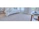 Spacious bedroom with carpeted floors and balcony access at 2120 Broome St, Kissimmee, FL 34743