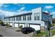 Modern building exterior with multiple units and garages at 2120 Broome St, Kissimmee, FL 34743