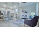 Open living room and kitchen with island and seating at 2120 Broome St, Kissimmee, FL 34743