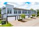 Modern townhomes with attached garages and landscaping at 2120 Broome St, Kissimmee, FL 34743