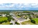 Aerial view showcasing community, lake, and surrounding landscape at 2120 Broome St, Kissimmee, FL 34743