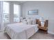 Cozy bedroom with queen-size bed and plenty of natural light at 2120 Broome St, Kissimmee, FL 34743