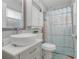 Clean bathroom with a white sink, toilet and shower/tub combo at 30503 Grandview Dr, Leesburg, FL 34748