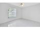 Bright bedroom with tiled floors and ceiling fan at 148 Merida Dr, Kissimmee, FL 34743