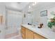 Bathroom with wood vanity and shower/tub combo at 148 Merida Dr, Kissimmee, FL 34743