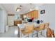 Kitchen features light wood cabinets and breakfast bar at 148 Merida Dr, Kissimmee, FL 34743