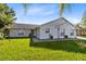 White brick home with a well-maintained lawn at 148 Merida Dr, Kissimmee, FL 34743
