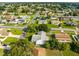 Aerial view of a house and surrounding neighborhood at 148 Merida Dr, Kissimmee, FL 34743