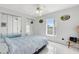 Bedroom with mirrored closet doors and ceiling fan at 148 Merida Dr, Kissimmee, FL 34743