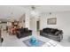 Open living and dining area with tile floors and a view of the kitchen at 148 Merida Dr, Kissimmee, FL 34743