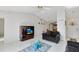 Bright living room with vaulted ceiling, tile floors, and comfy sofas at 148 Merida Dr, Kissimmee, FL 34743