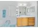 Clean bathroom with updated vanity and large mirror at 148 Merida Dr, Kissimmee, FL 34743