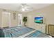 King bedroom with ensuite bath and TV at 5005 Laguna Bay Cir # 19, Kissimmee, FL 34746