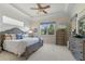 Spacious main bedroom with large windows and a ceiling fan at 4907 W Fountainwood Dr, St Cloud, FL 34772