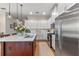 Modern kitchen with stainless steel appliances and a large island at 4907 W Fountainwood Dr, St Cloud, FL 34772