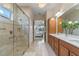 Large bathroom with walk-in shower and double vanity at 4907 W Fountainwood Dr, St Cloud, FL 34772
