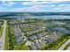 Aerial view of houses and lakes in a residential community at 4907 W Fountainwood Dr, St Cloud, FL 34772