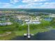 Aerial view of a community with a clubhouse, pool, and lake access at 4907 W Fountainwood Dr, St Cloud, FL 34772