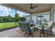 Spacious screened patio with comfortable seating and a fire pit, perfect for outdoor relaxation at 4907 W Fountainwood Dr, St Cloud, FL 34772