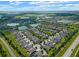 Aerial view of a large community with lakes and numerous homes at 4907 W Fountainwood Dr, St Cloud, FL 34772