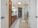 Spa-like bathroom with double sinks, walk-in shower, and linen closet at 4907 W Fountainwood Dr, St Cloud, FL 34772