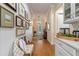 Inviting entryway with wood floors and gallery wall at 4907 W Fountainwood Dr, St Cloud, FL 34772