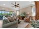 Comfortable living room featuring hardwood floors and a fireplace at 4907 W Fountainwood Dr, St Cloud, FL 34772