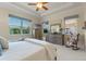 Bright main bedroom featuring a king-size bed and ample closet space at 4907 W Fountainwood Dr, St Cloud, FL 34772