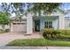 Light blue house with a front porch and two-car garage at 4907 W Fountainwood Dr, St Cloud, FL 34772