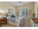 Guest bedroom with plantation shutters and a view of the backyard at 4907 W Fountainwood Dr, St Cloud, FL 34772