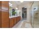 Elegant bathroom with double vanity, walk-in shower, and ample storage at 4907 W Fountainwood Dr, St Cloud, FL 34772