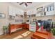 Home office with built-in shelving and hardwood floors at 4907 W Fountainwood Dr, St Cloud, FL 34772