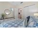 Guest bedroom with bed, dresser, and access to other rooms at 4907 W Fountainwood Dr, St Cloud, FL 34772