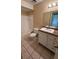 Clean bathroom with a single sink vanity, shower/tub combo, and tile floor at 13953 Fairway Island Dr # 624, Orlando, FL 32837