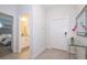 Bright entryway with glass-top console table and view of bedroom and bathroom at 4804 Memories Ln, Kissimmee, FL 34746