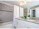 Double vanity, gray countertop, and a large walk-in shower at 4804 Memories Ln, Kissimmee, FL 34746
