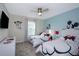 Mickey Mouse-themed bedroom with two twin-size beds at 4804 Memories Ln, Kissimmee, FL 34746
