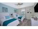 Two twin beds with teal bedding and a calming atmosphere at 4804 Memories Ln, Kissimmee, FL 34746
