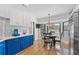 Eat-in kitchen with a round table and chairs and a view to the backyard at 8692 Vesta Ter, Orlando, FL 32825