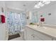 Clean bathroom with shower/tub combo, vanity, and updated fixtures at 8692 Vesta Ter, Orlando, FL 32825