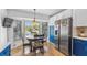 Bright kitchen nook with a round table and chairs, overlooking the backyard at 8692 Vesta Ter, Orlando, FL 32825