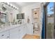 Bright bathroom with a vanity, toilet and access to backyard at 8692 Vesta Ter, Orlando, FL 32825